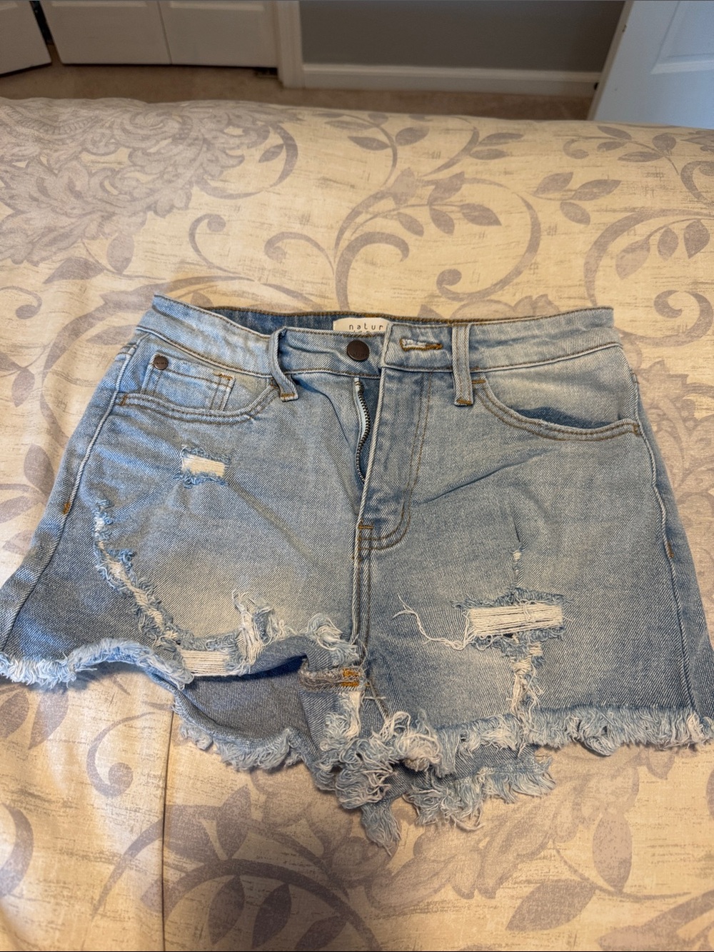 High-Rise Light Blue Distressed Denim Shorts